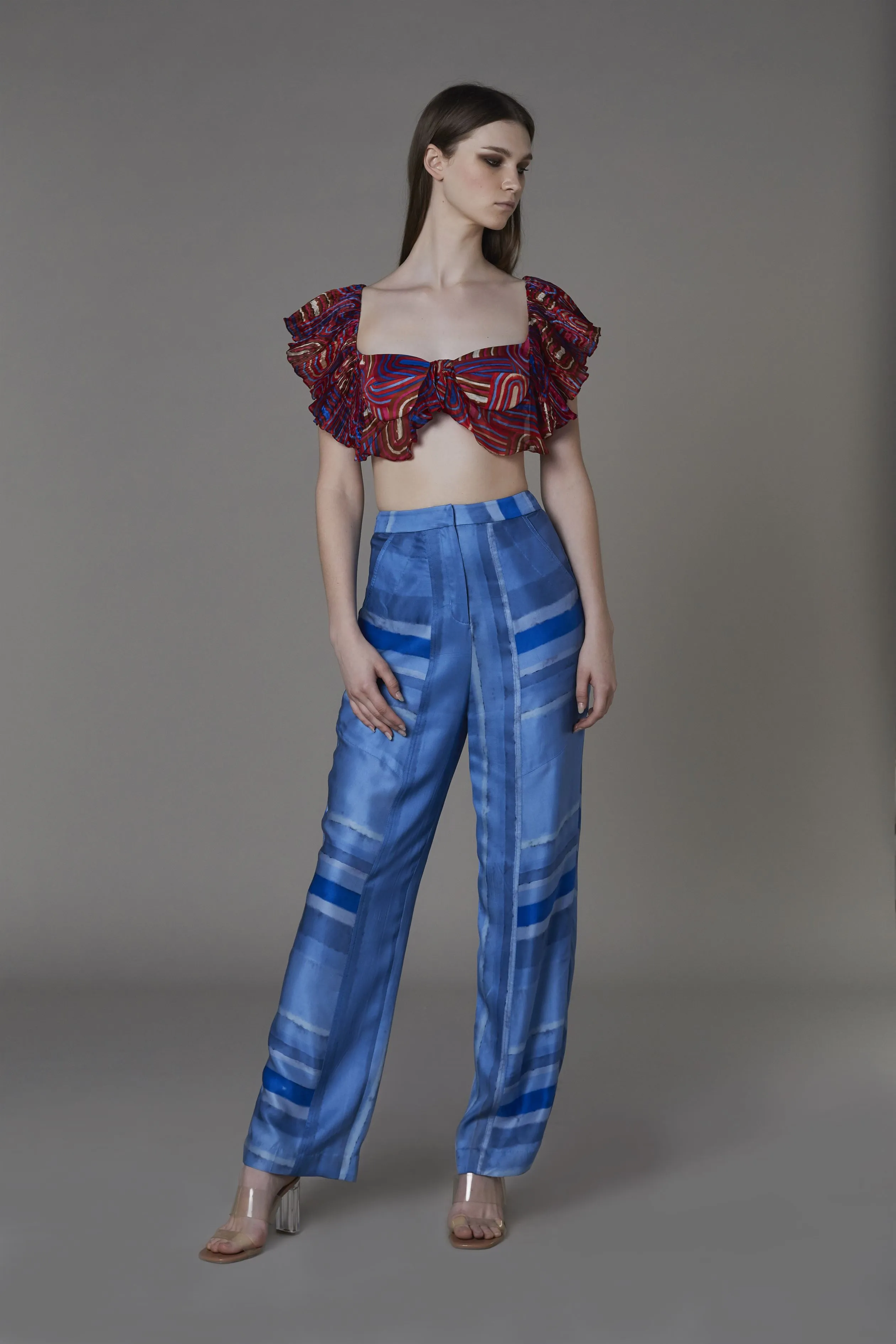 Saaksha & KinniÂ    I   Red semi circle filmy bra  Light blue/blue stripe pants Bralette - Chiffon / Satin  Trousers - Satin Bralette - Red/Multi  Trousers - Blue SS22132    SS22123